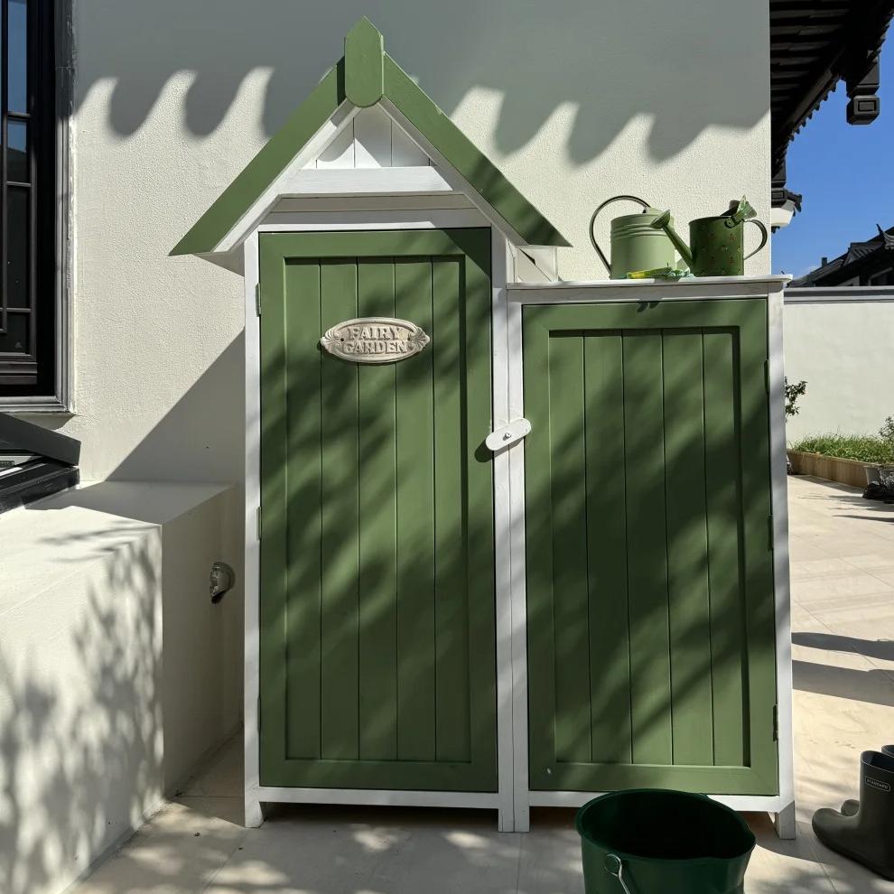 Charming Green Garden Shed with a Cottage
